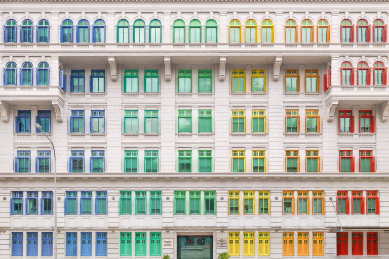 Colourful windows on old police headquarters, Singapore