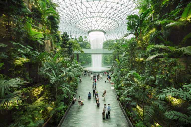 Indoor waterfall with tropical house at the Jewel at Changi Airport in Singapore